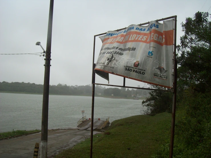 an advertit with some advertising is on a pole