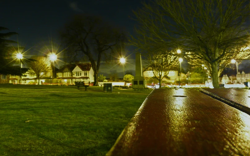 a city street that has grass and trees in it