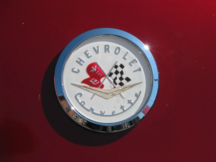 a chevrolet clock in the middle of a red background