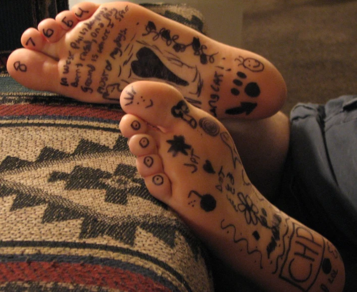 someone with feet covered in drawings on them