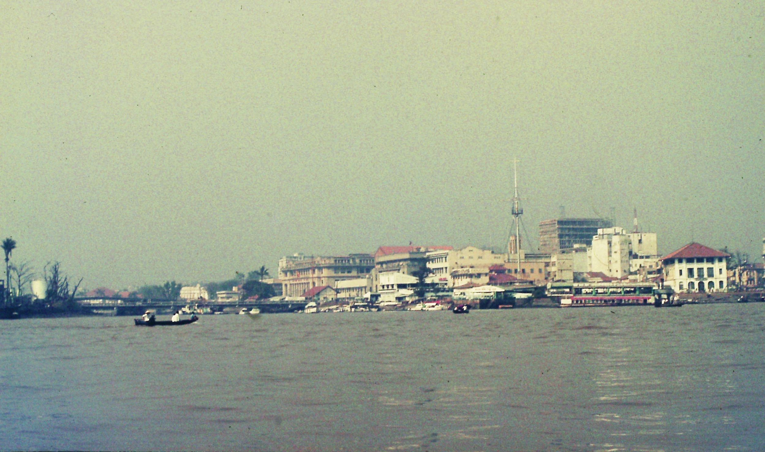 many boats floating in a large body of water