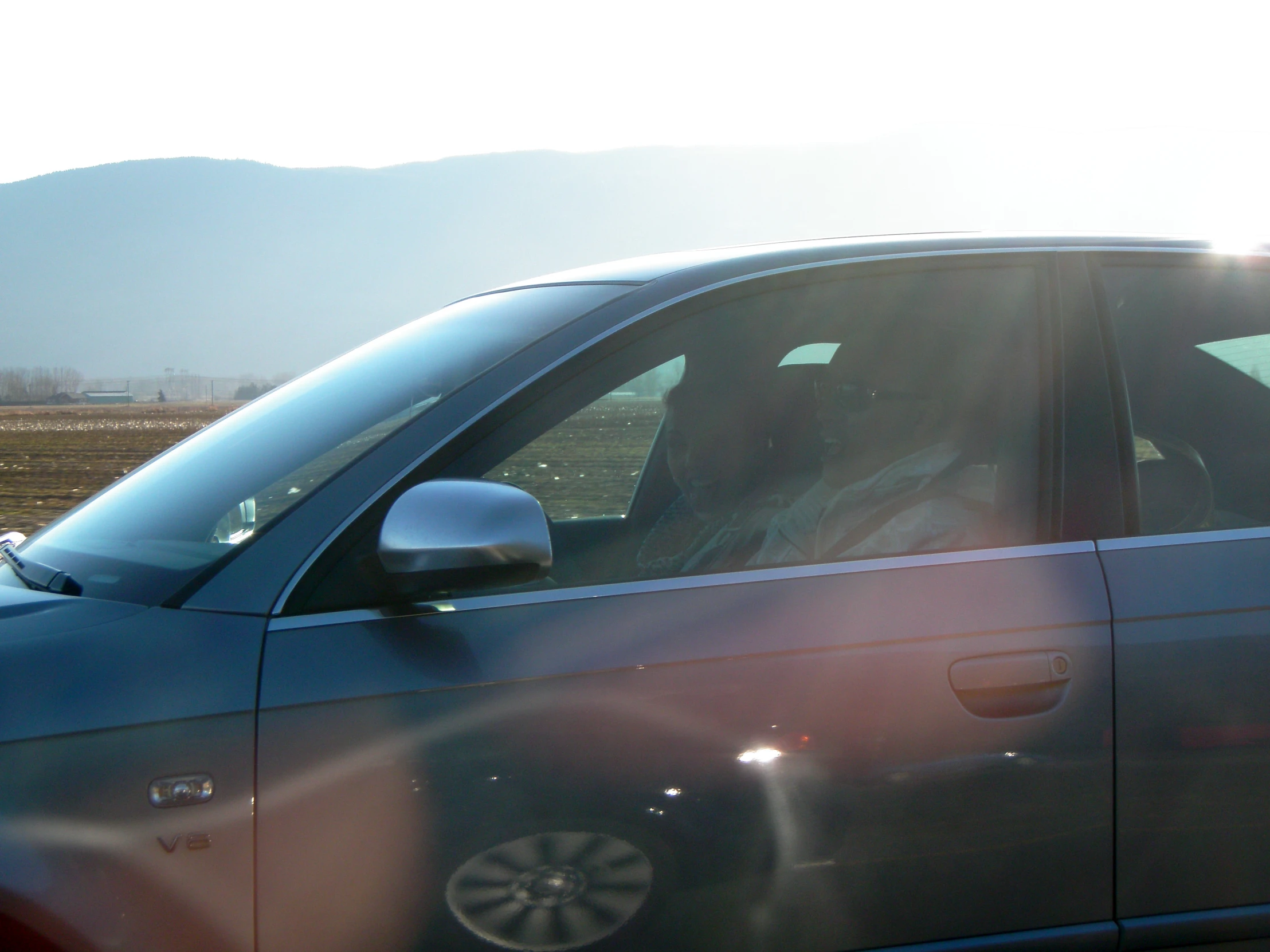 this car is parked on the side of the road