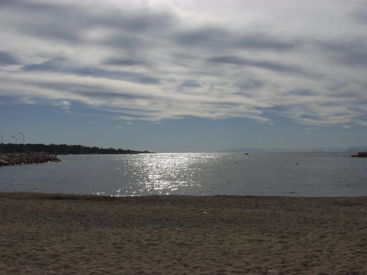 a body of water is shown with the ocean in the background