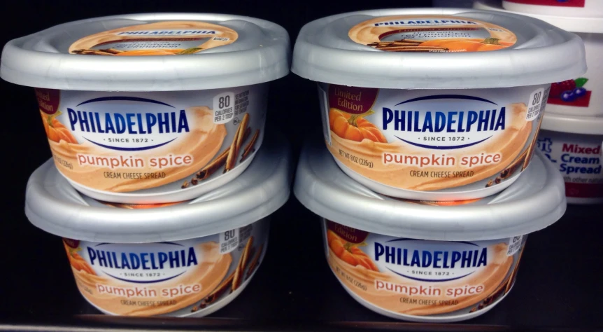 four cups of philadelphia pumpkin spice sit on a shelf