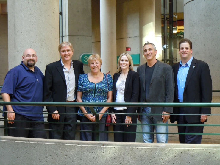 a group of people standing in front of a building