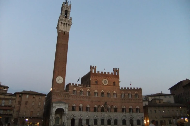 an old building with a clock tower next to it