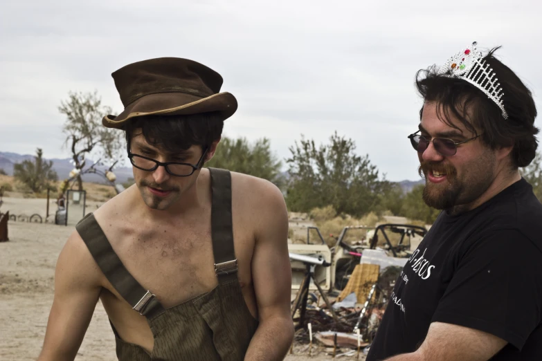 two men looking at a map with the camera