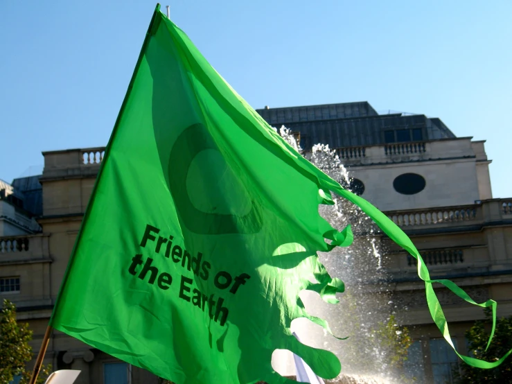 green flags are flying in front of a castle