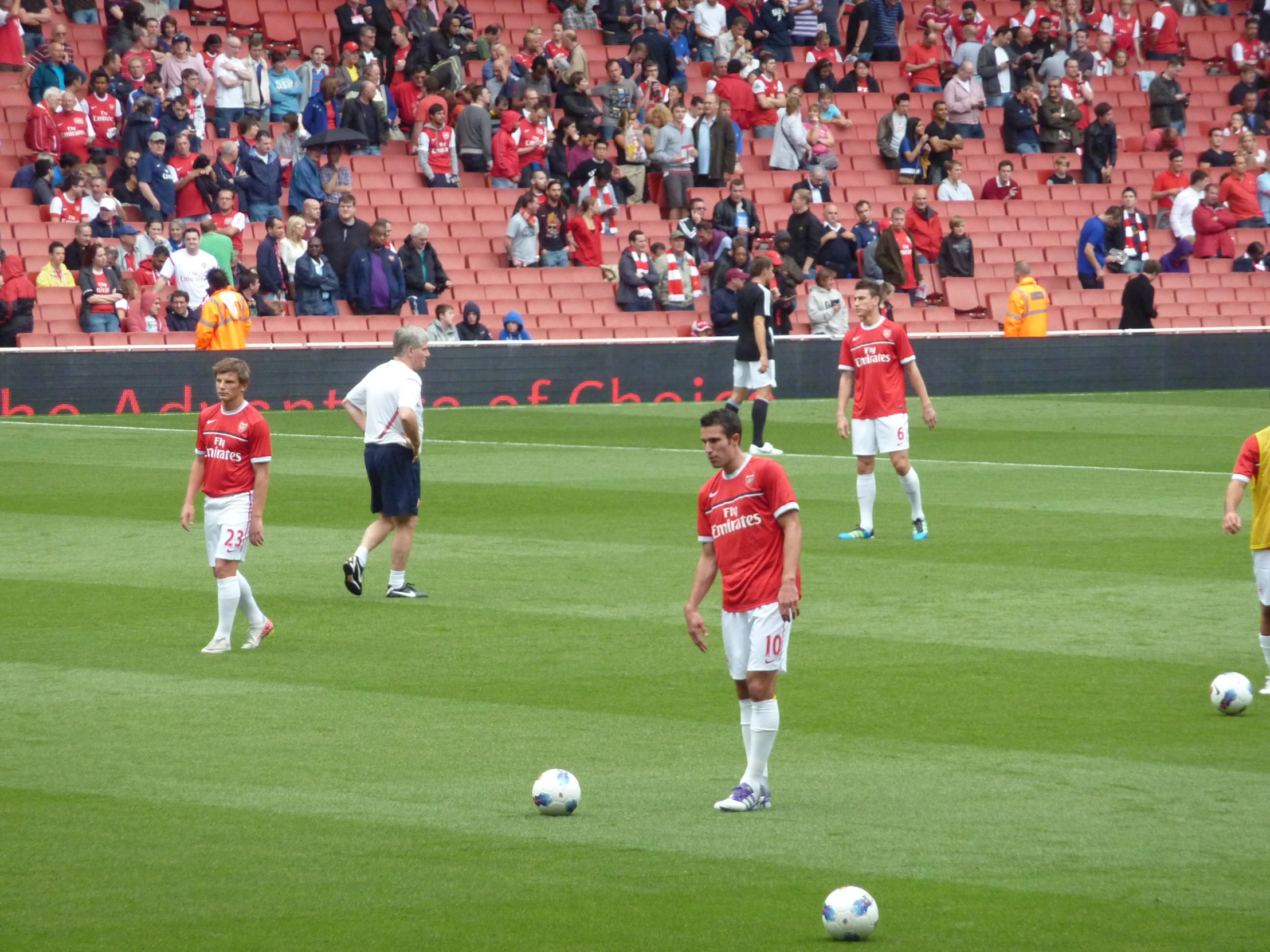 several men on a soccer field with a ball