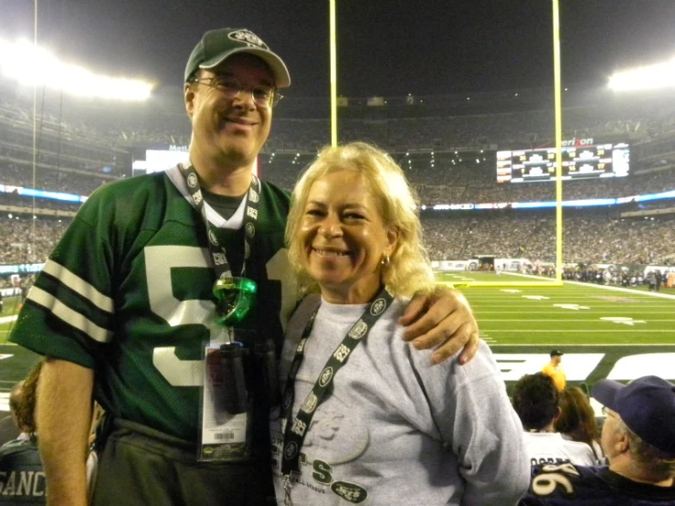 a man and woman on a football field