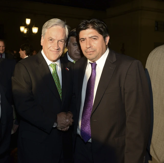 a pair of men standing in a room