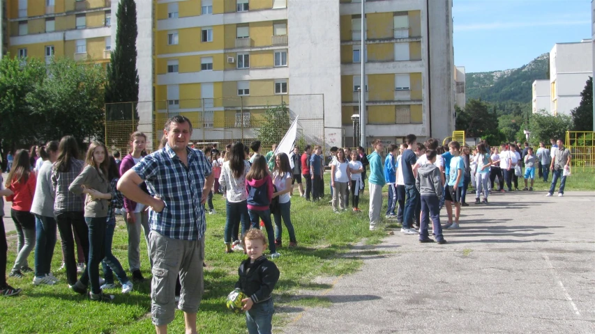 a group of people that are walking down a road