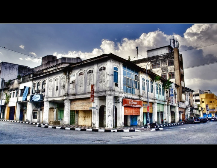 the multi - colored building is situated at the corner