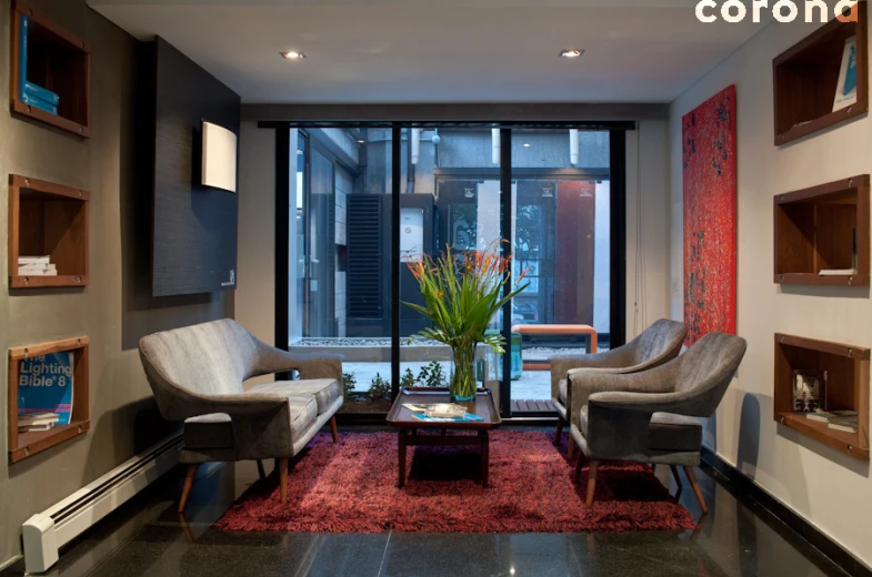 a living room with chairs and a table