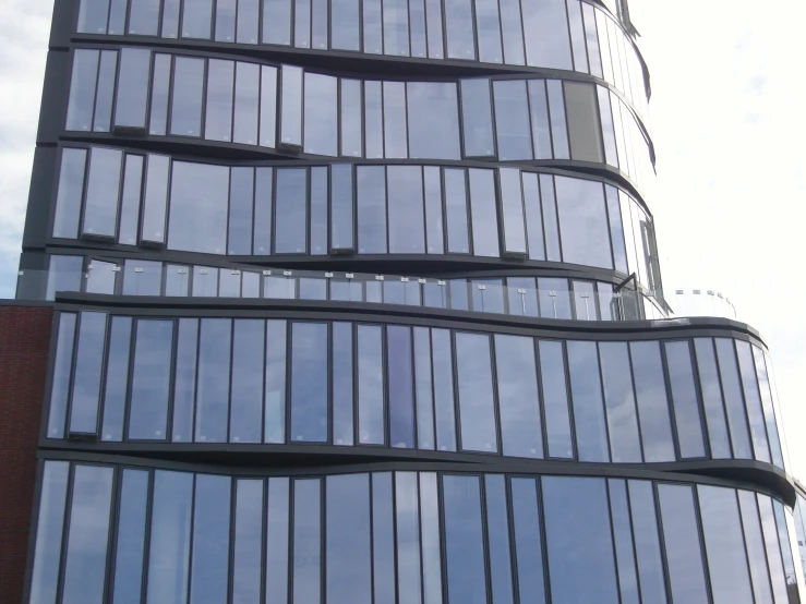 a large tall building that is covered in glass