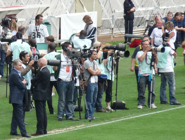 a camera filming people in a soccer field