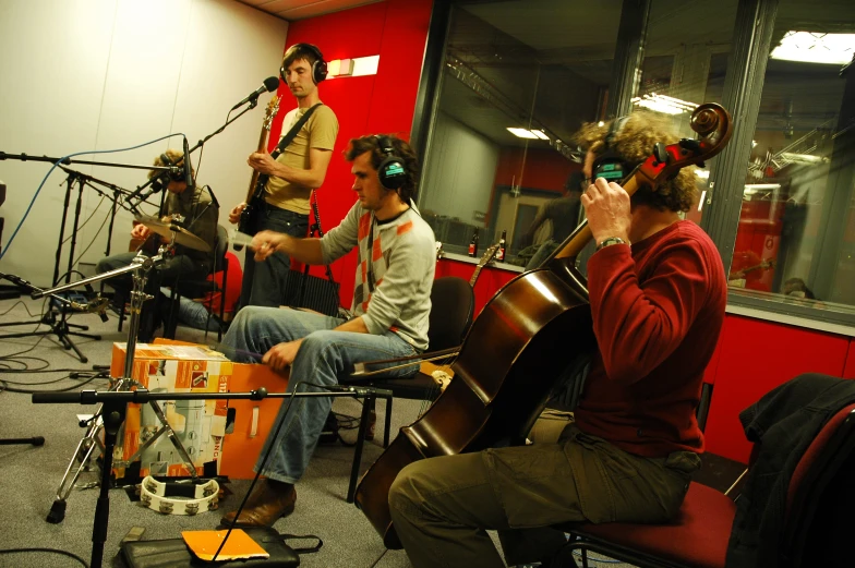 a group of people sitting and listening to music