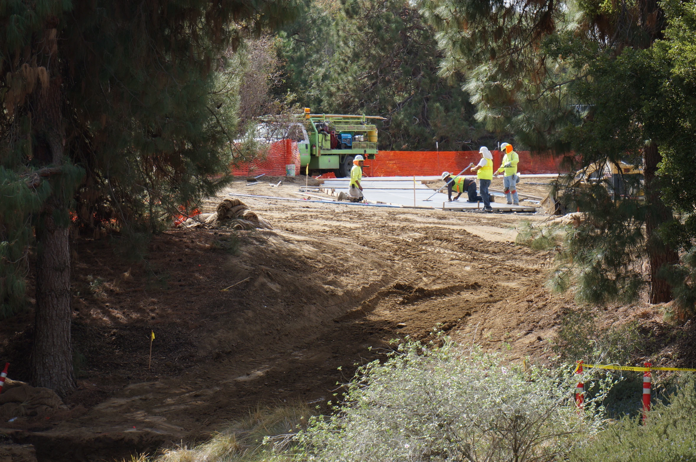 construction workers are busy in the open field