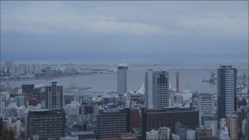 view of the city in fog with boats on it