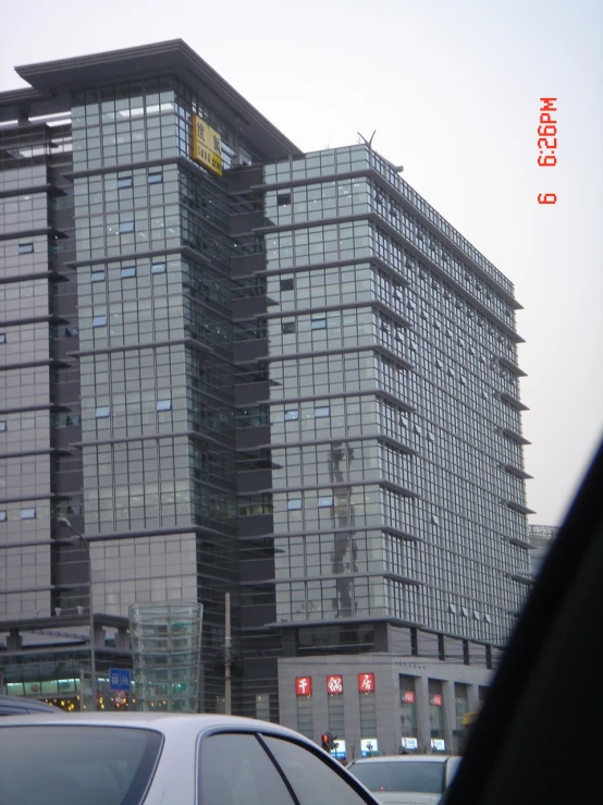 a tall building with a black covering on top