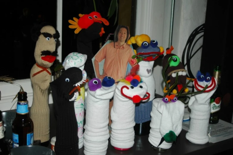 there are many puppets displayed on a table