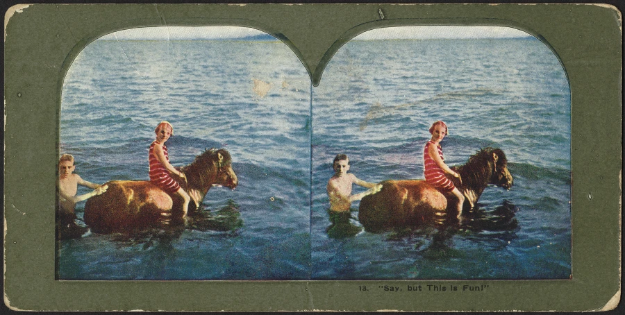 two women on horseback crossing the water