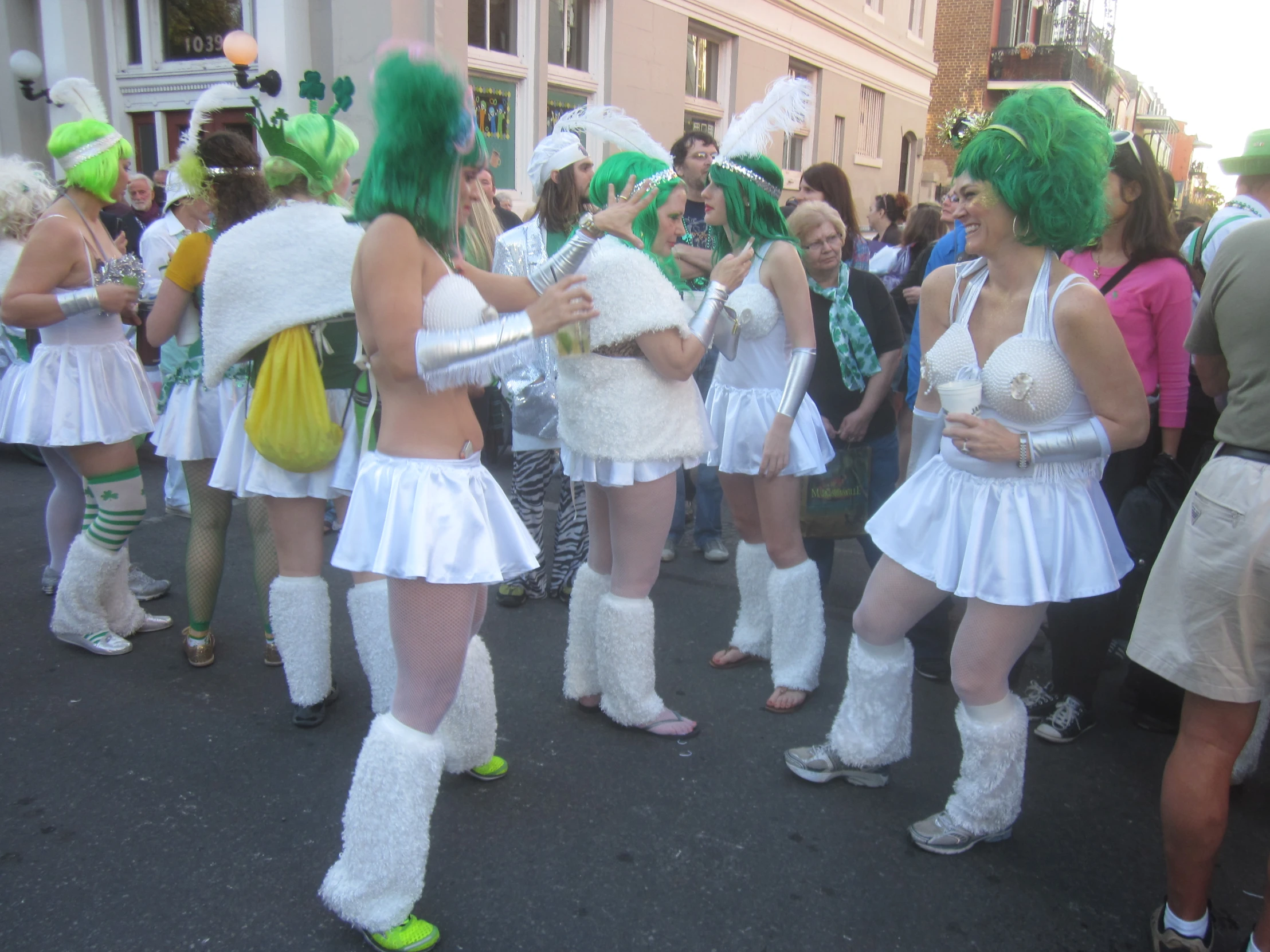 women are dressed in costumes during a parade