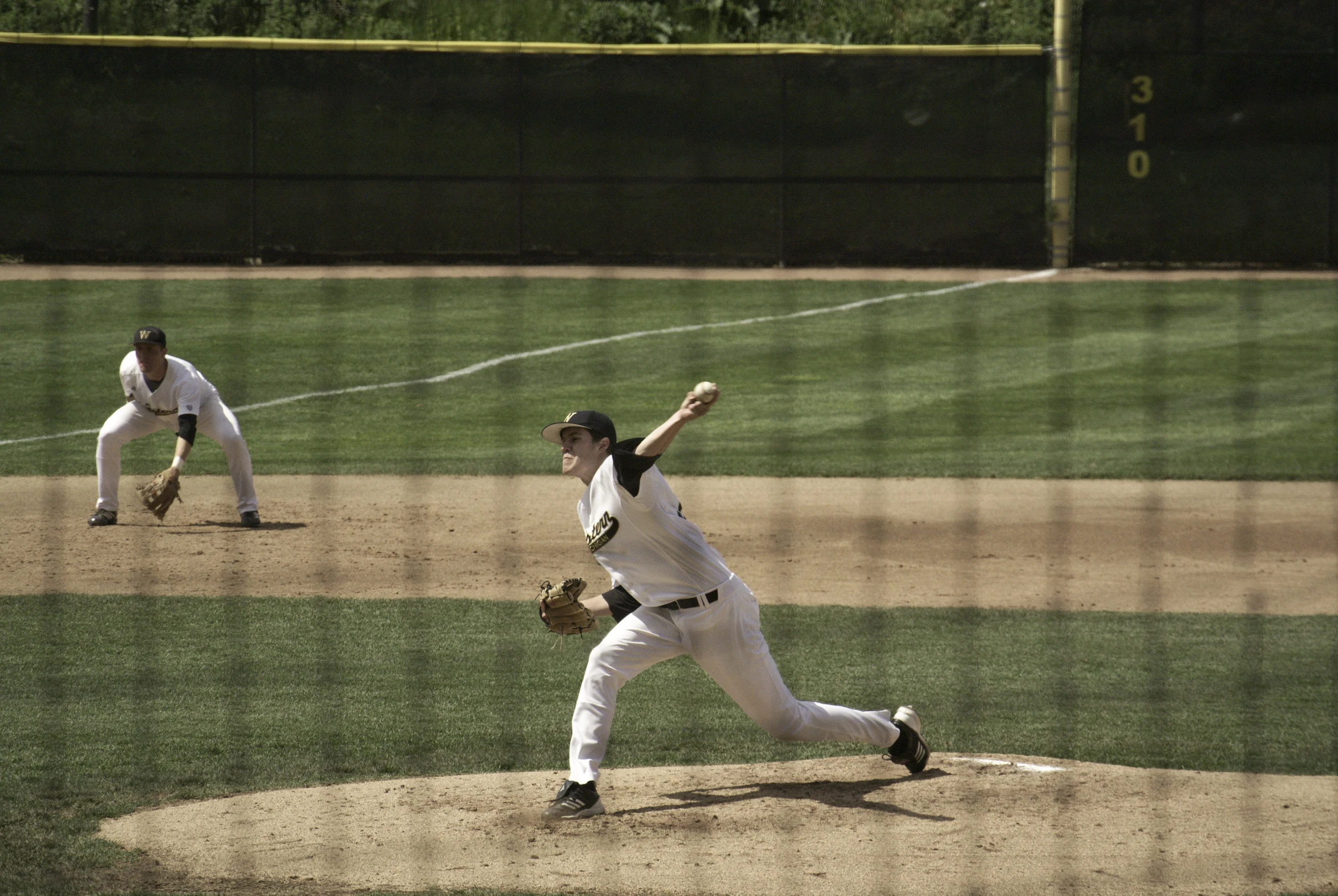 two baseball players on the field playing ball