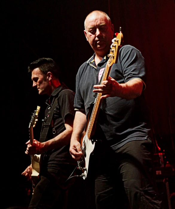 a group of men standing next to each other on stage