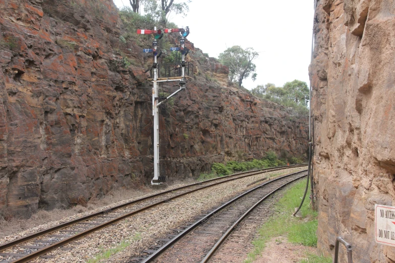 a train track going through an old wall