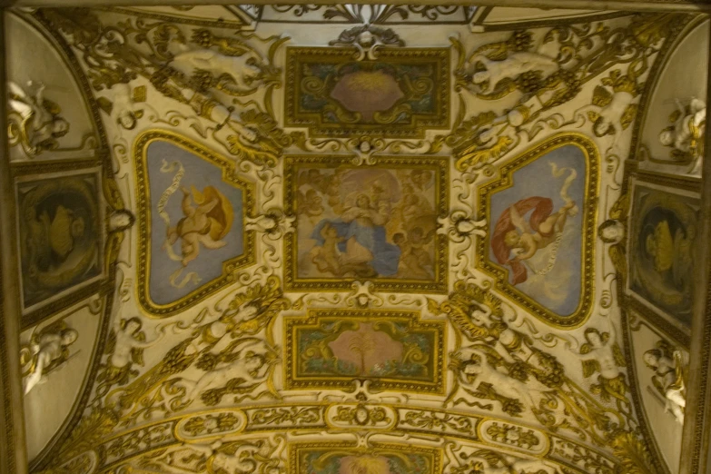 the ceiling in a room has many pictures on it