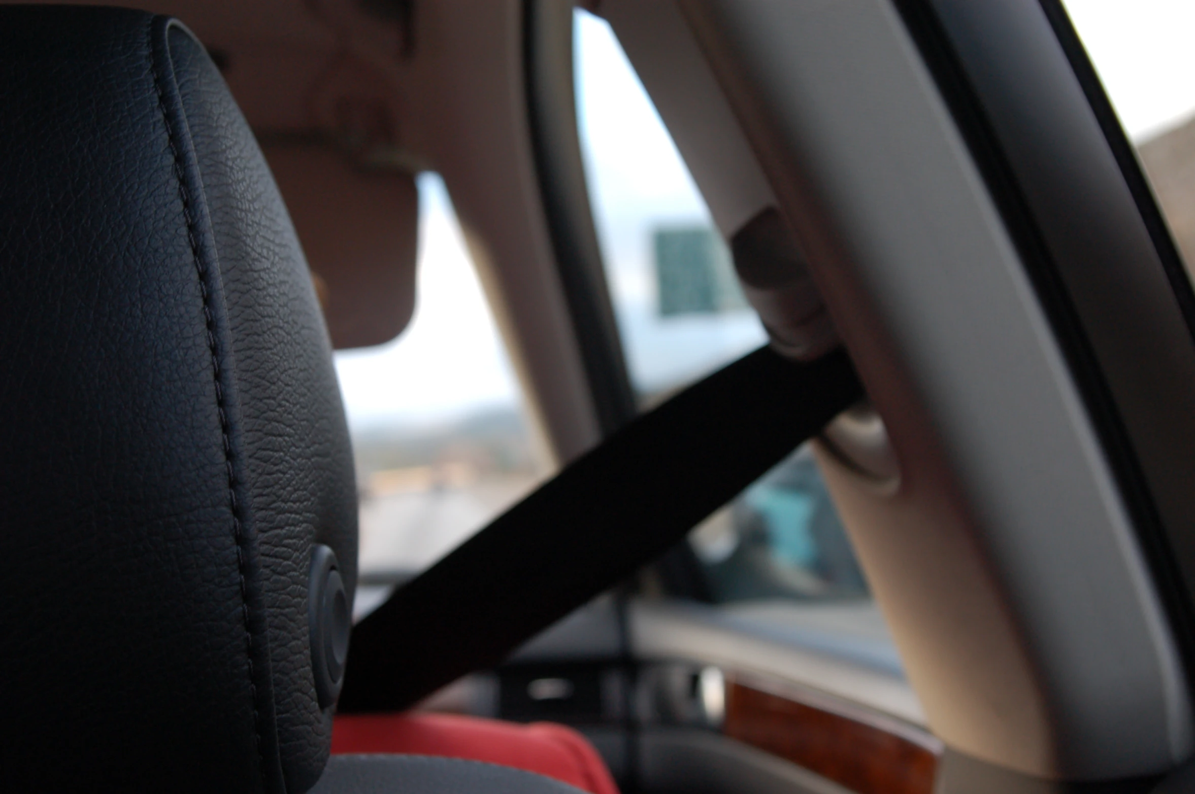 a person driving a car with the sun shining through the windows