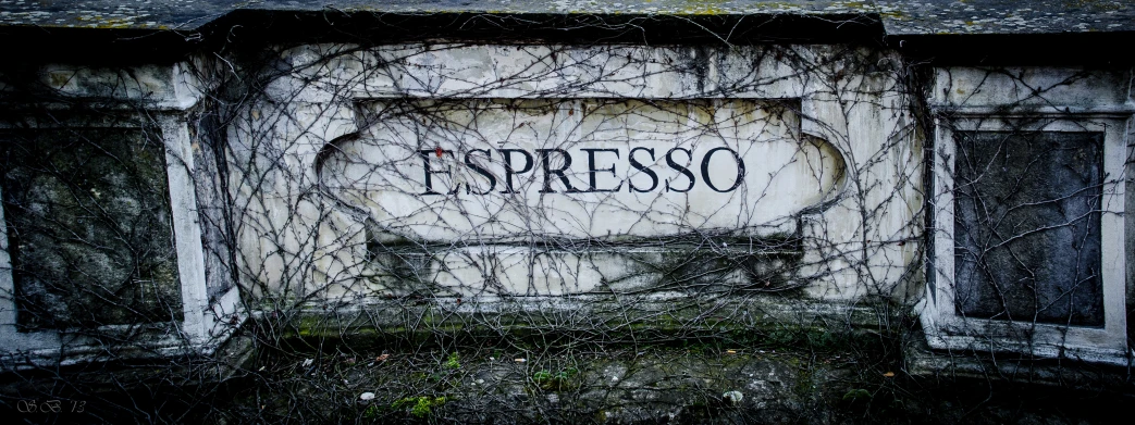 a very old, and worn up, outdoor sign in an abandoned structure