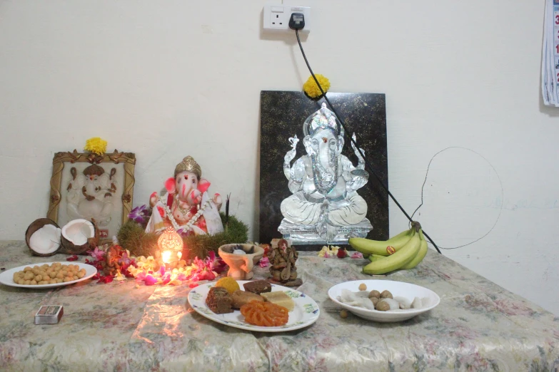 a table with food and a lit candle on it