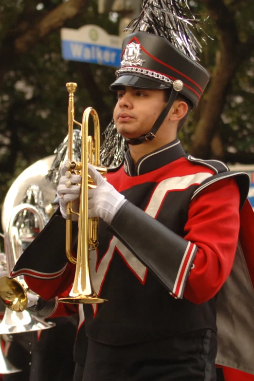 a man with a pipe in a marching uniform