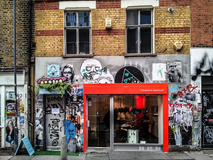 a store front that has graffiti all over it