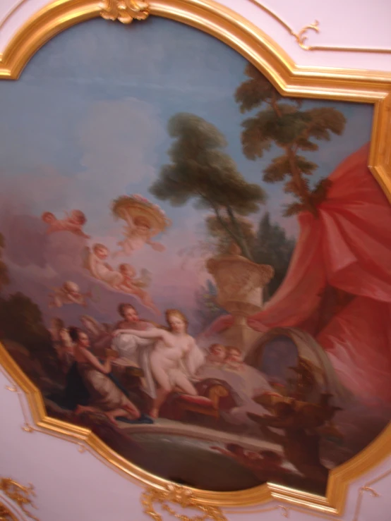 an ornate ceiling painting on the inside of a room