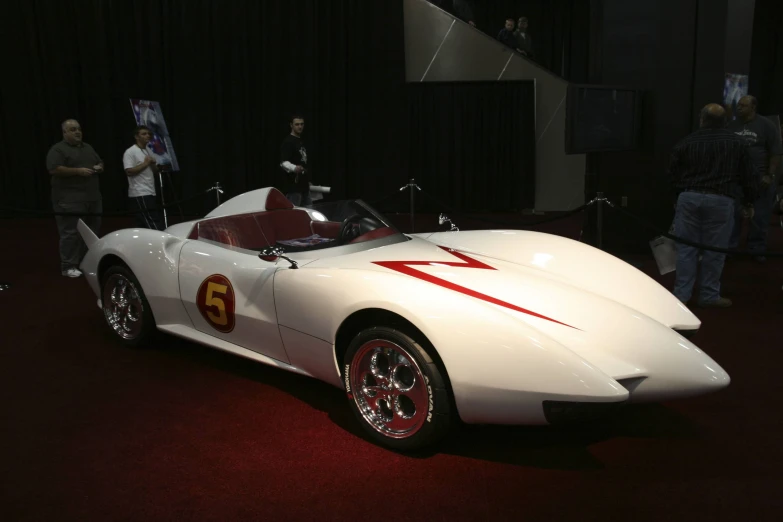 a racing car sitting on display at an event