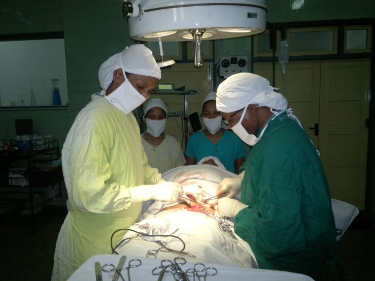 a group of medical staff performing  on a patient