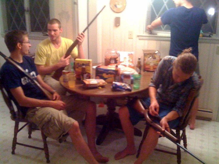 there is a group of men playing baseball at the table