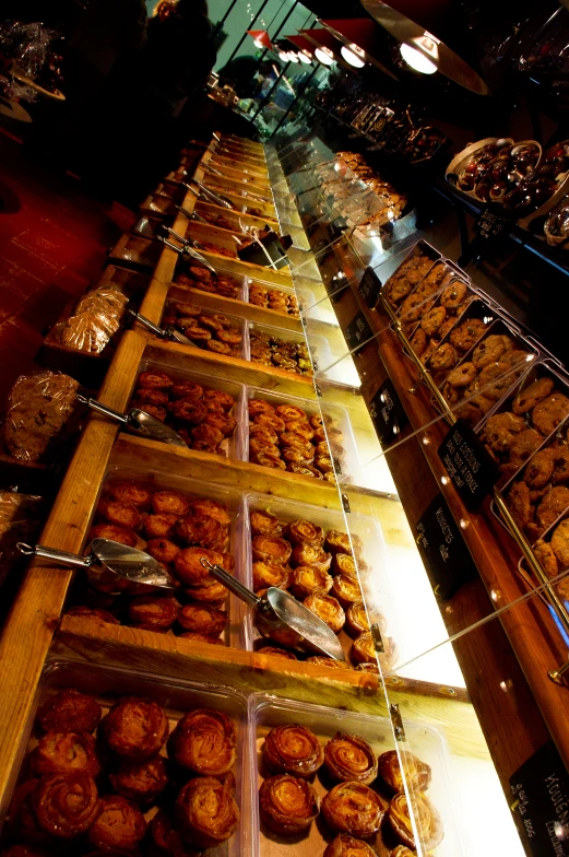 bakery shop filled with trays of pastries and desserts