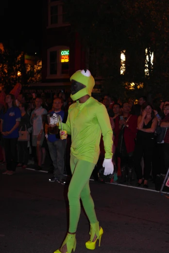 people wearing costumes stand in the street