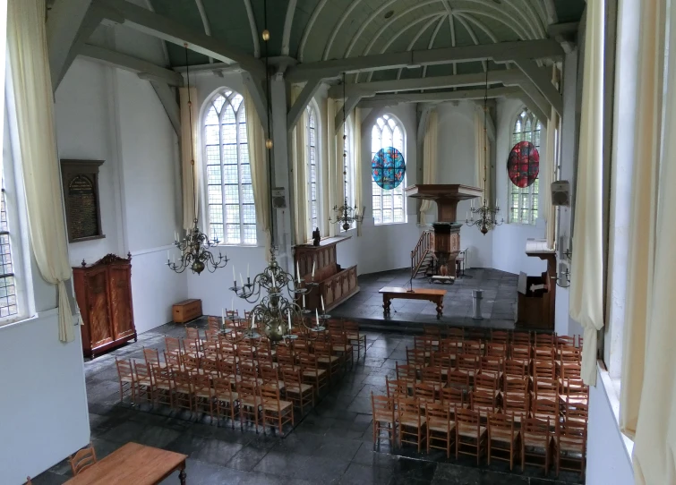 an interior view of a church showing chairs and altar