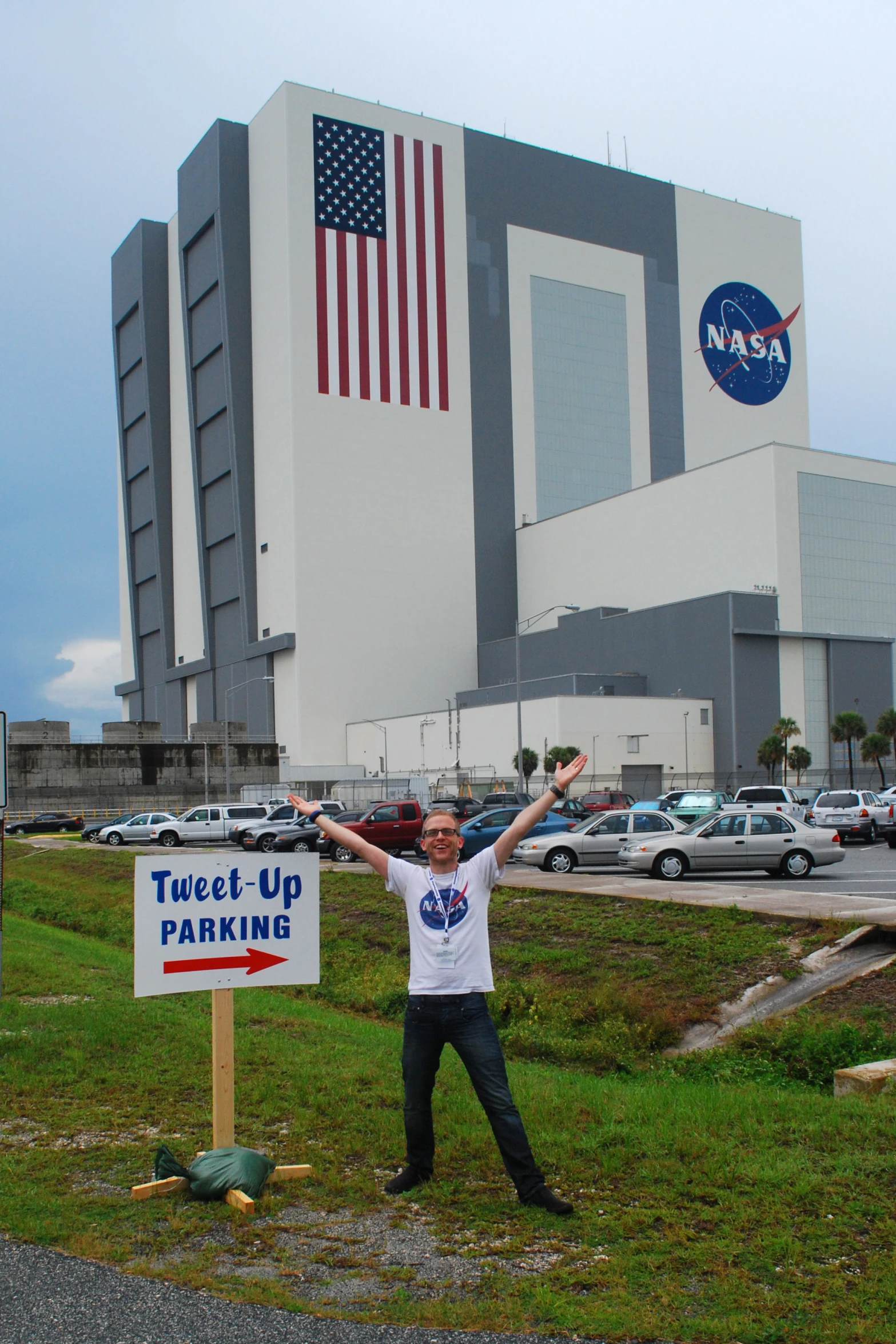 this is a po of a man in front of a nasa building