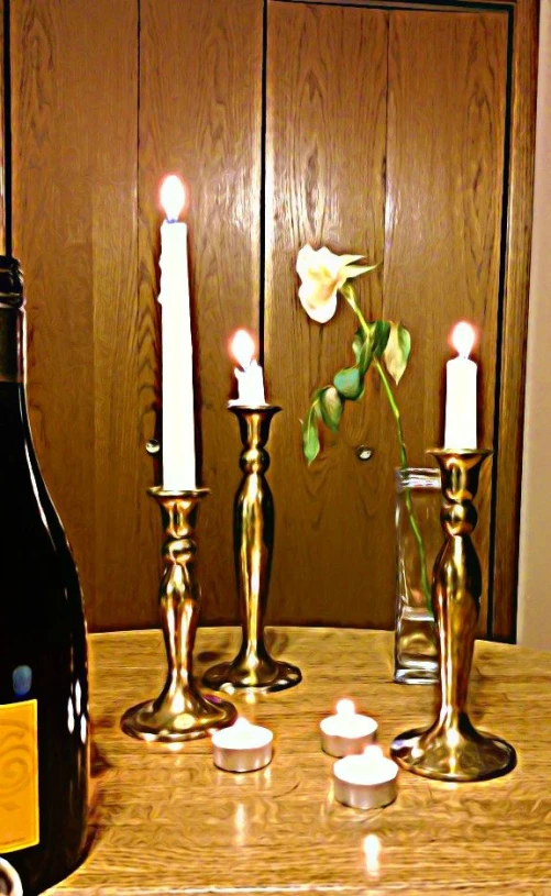 bottles of wine, candles, and a wine bottle on a table