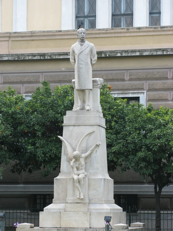 a statue depicting two men standing over a war memorial