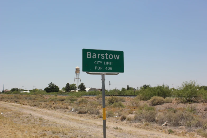 a road sign pointing in the direction of barstow