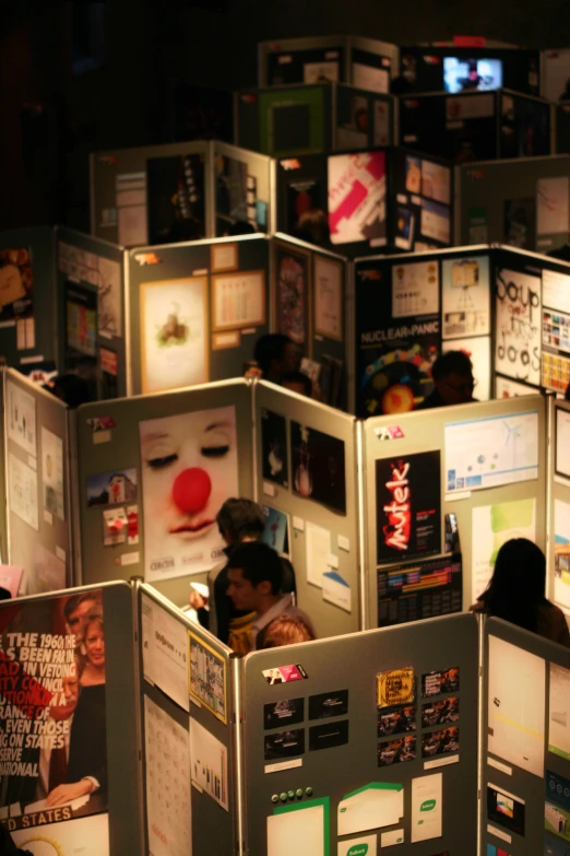 group of people in room with display of information