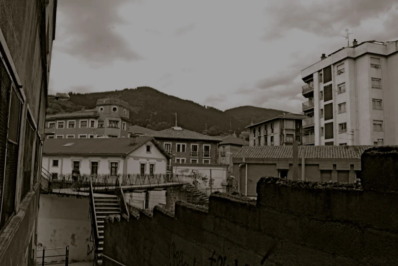 the top of a building with balconies in a city