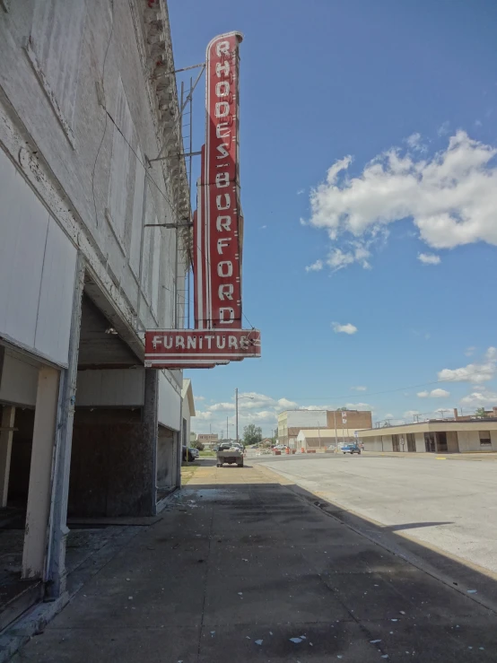 a building with a large neon sign on it's side